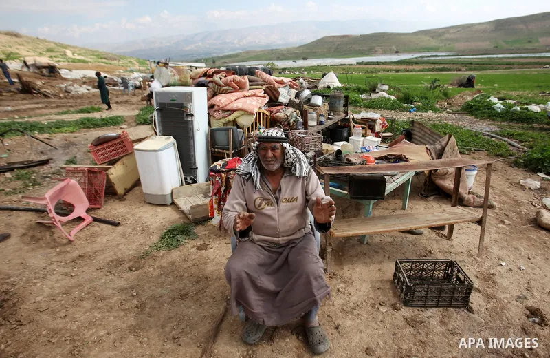 A Palestinian man sits on the rubble of his house that was demolished by the Israeli army, in the Jordan valley, near the West Bank town of Tubas on February 11, 2016. Israel is planning to annex the Jordan Valley into a...