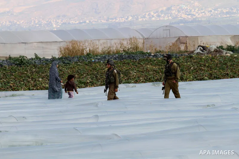 Israeli security forces stand guard during Israeli bulldozers demolish Palestinian homes in the Jordan valley, near the West Bank town of Tubas on February 11, 2016. Israel is planning to annex the Jordan Valley into a c...