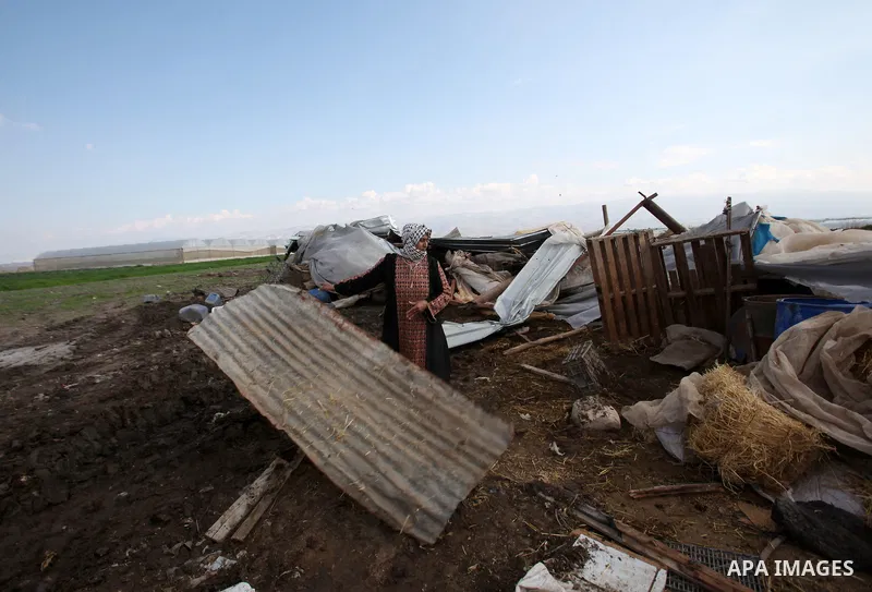 A Palestinian woman inspects the rubble of her house that were demolished by the Israeli army, in the Jordan valley, near the West Bank town of Tubas on February 11, 2016. Israel is planning to annex the Jordan Valley in...
