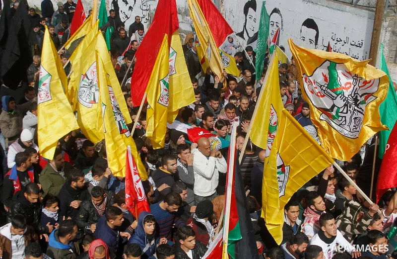 Palestinian mourners carry the body of Omar Jawabra, who was killed by Israeli fire during clashes near Hebron the day before, during his funeral at al-Aroub Palestinian refugee camp, north the West Bank city of Hebron o...