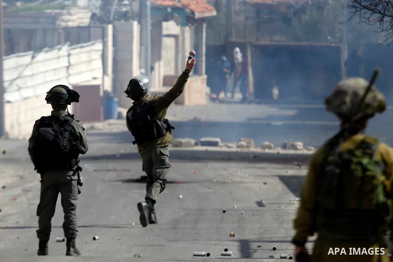 Palestinian protesters clash with Israeli security forces following the funeral of Omar Jawabra, who was killed by Israeli fire during clashes near hebron the day before, at al-Aroub Palestinian refugee camp, north the W...