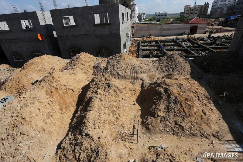 Palestinian children stand near the building columns for their families houses , destroyed during 2014 war, in Shijaiyah neighborhood in the east of Gaza city on Feb. 11, 2016. Rebuilding of Palestinian houses which dest...