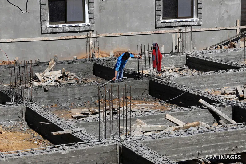 Palestinian children stand near the building columns for their families houses , destroyed during 2014 war, in Shijaiyah neighborhood in the east of Gaza city on Feb. 11, 2016. Rebuilding of Palestinian houses which dest...