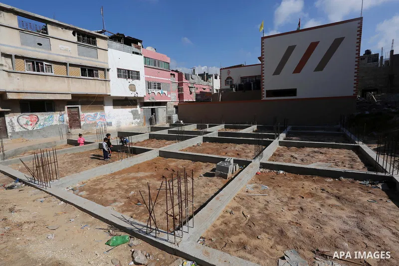 Palestinian children stand near the building columns for their families houses , destroyed during 2014 war, in Shijaiyah neighborhood in the east of Gaza city on Feb. 11, 2016. Rebuilding of Palestinian houses which dest...