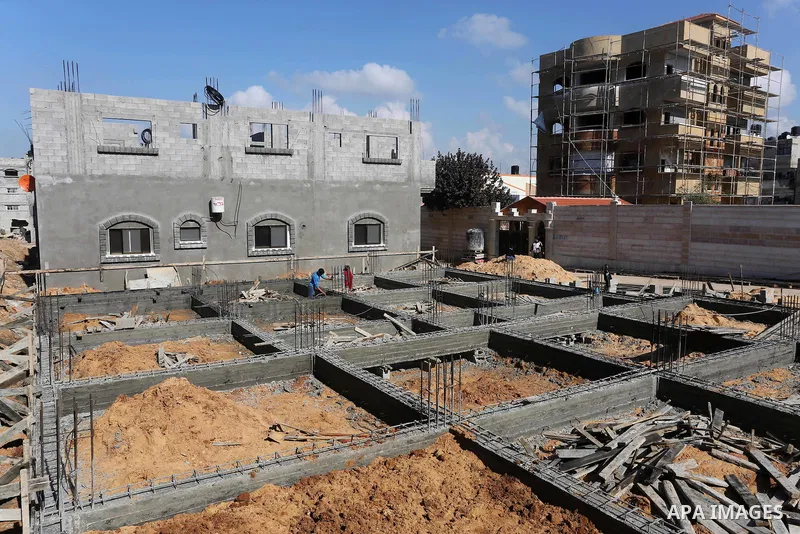 Palestinian children stand near the building columns for their families houses , destroyed during 2014 war, in Shijaiyah neighborhood in the east of Gaza city on Feb. 11, 2016. Rebuilding of Palestinian houses which dest...
