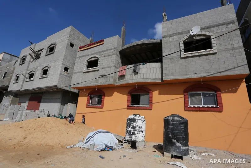 Palestinian children play in front of the remains of a house, destroyed during 2014 war, in Shijaiyah neighborhood in the east of Gaza city on Feb. 11, 2016. Rebuilding of Palestinian houses which destroyed during 2014 w...
