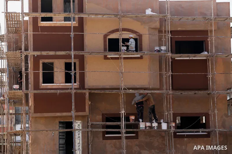 Palestinians work at houses which destroyed during 2014 war, in Shijaiyah neighborhood in the east of Gaza city on Feb. 11, 2016. Rebuilding of Palestinian houses which destroyed during 2014 war and funded by Kuwaiti gra...