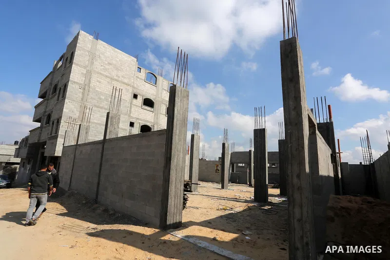 Palestinian children stand near the building columns for their families houses , destroyed during 2014 war, in Shijaiyah neighborhood in the east of Gaza city on Feb. 11, 2016. Rebuilding of Palestinian houses which dest...