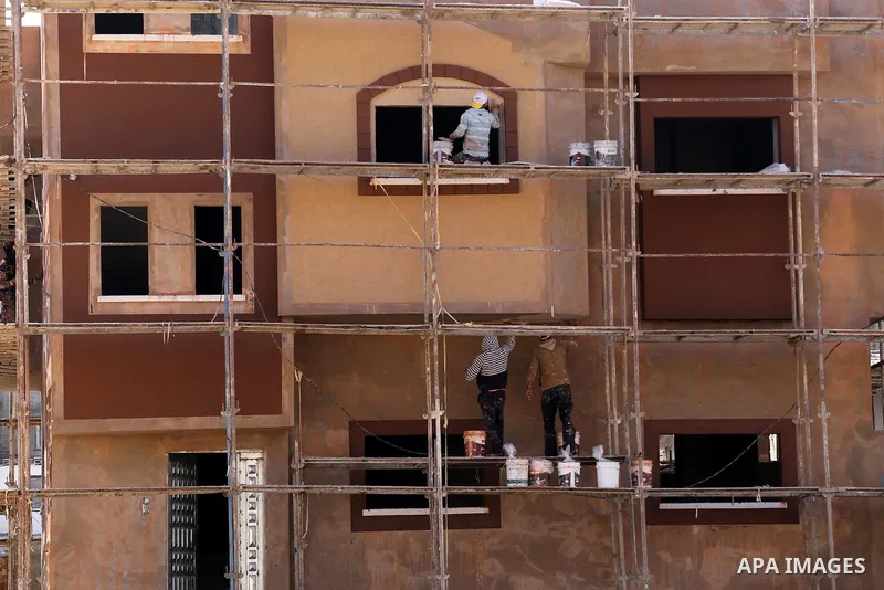 Palestinians work at houses which destroyed during 2014 war, in Shijaiyah neighborhood in the east of Gaza city on Feb. 11, 2016. Rebuilding of Palestinian houses which destroyed during 2014 war and funded by Kuwaiti gra...