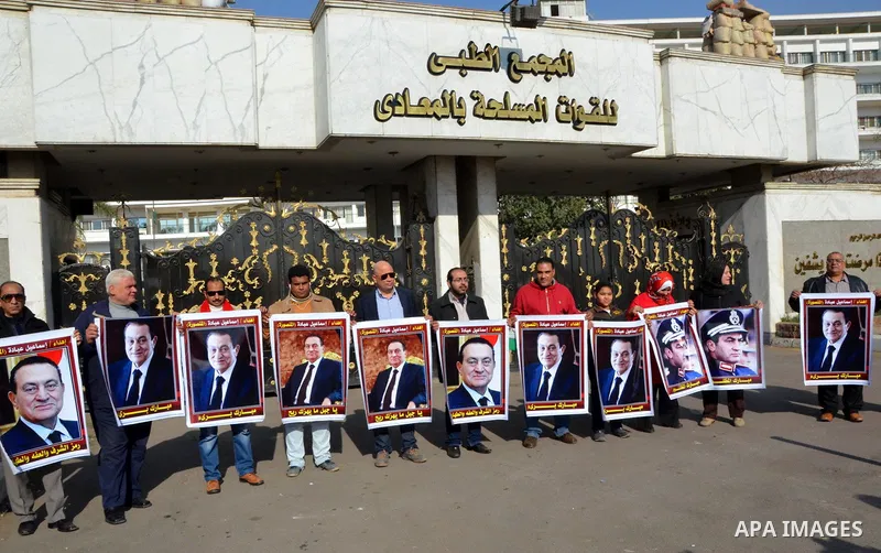 Supporters of Egypt's former president Hosni Mubarak take part during a protest to show solidarity with him outside the Maadi military hospital in Cairo on Feb. 11, 2016. Photo by Amr Sayed