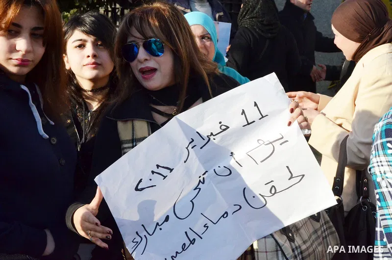 Supporters of Egypt's former president Hosni Mubarak take part during a protest to show solidarity with him outside the Maadi military hospital in Cairo on Feb. 11, 2016. Photo by Amr Sayed