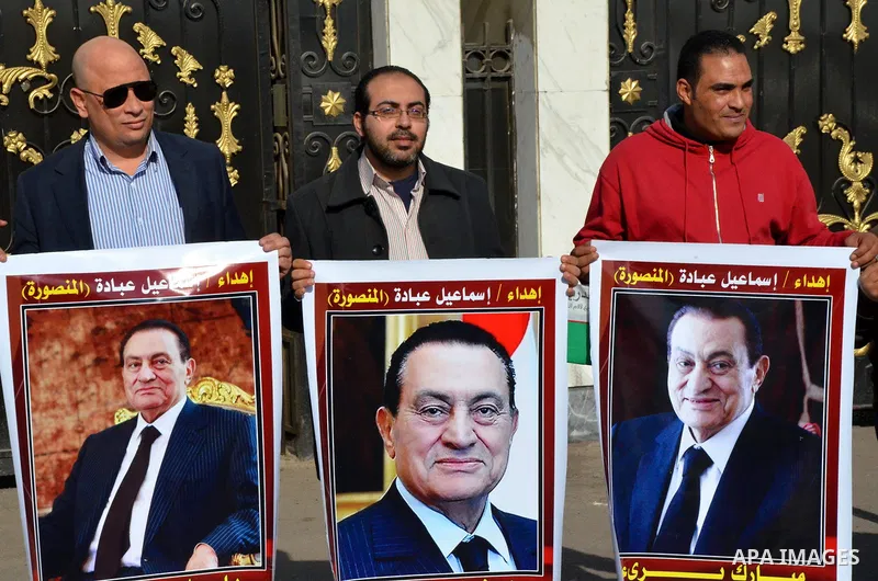 Supporters of Egypt's former president Hosni Mubarak take part during a protest to show solidarity with him outside the Maadi military hospital in Cairo on Feb. 11, 2016. Photo by Amr Sayed