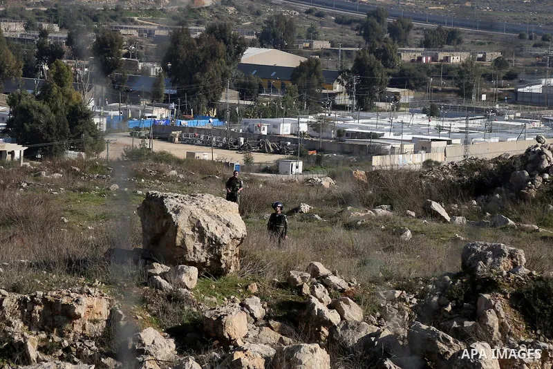 Israeli security forces take position during clashes with Israeli security forces following a demonstration in solidarity with Palestinian prisoners in Israeli jails, outside the compound of the Israeli Ofer Military Pri...