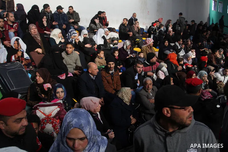 Palestinians await permission to enter Egypt as they gather at the Rafah border crossing in the southern Gaza Strip on February 13, 2016. The Gaza Strip's border crossing with Egypt at Rafah is set to reopen for two days...