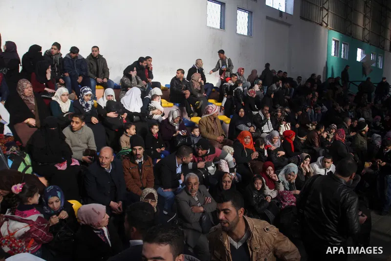 Palestinians await permission to enter Egypt as they gather at the Rafah border crossing in the southern Gaza Strip on February 13, 2016. The Gaza Strip's border crossing with Egypt at Rafah is set to reopen for two days...