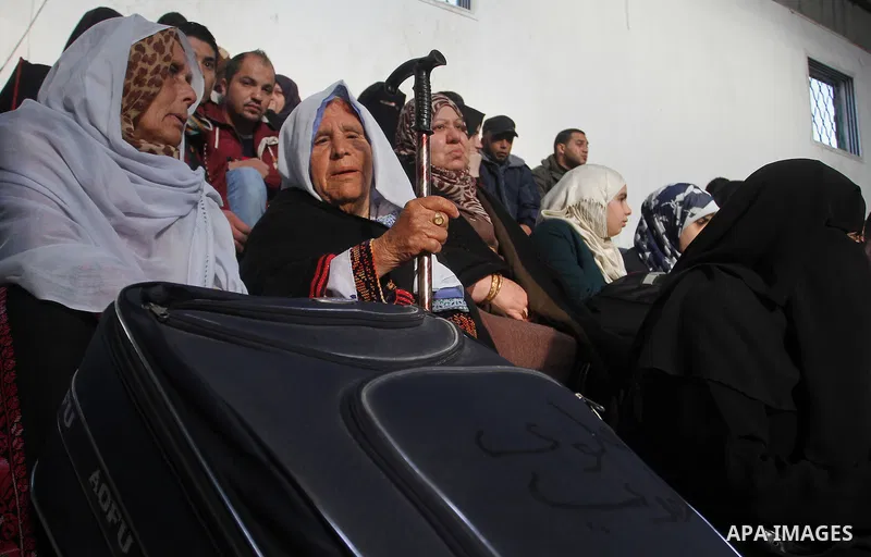 Palestinians await permission to enter Egypt as they gather at the Rafah border crossing in the southern Gaza Strip on February 13, 2016. The Gaza Strip's border crossing with Egypt at Rafah is set to reopen for two days...