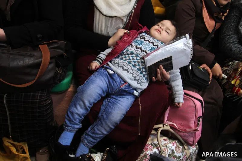 Palestinians await permission to enter Egypt as they gather at the Rafah border crossing in the southern Gaza Strip on February 13, 2016. The Gaza Strip's border crossing with Egypt at Rafah is set to reopen for two days...