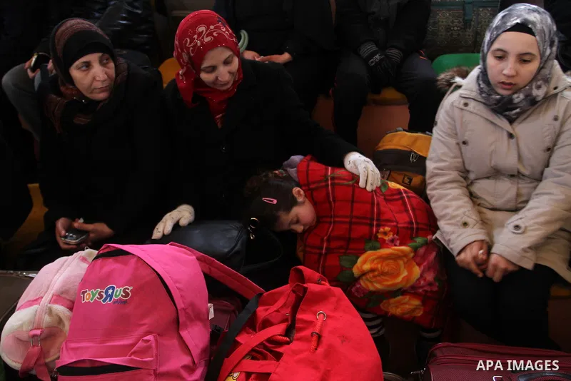 Palestinians await permission to enter Egypt as they gather at the Rafah border crossing in the southern Gaza Strip on February 13, 2016. The Gaza Strip's border crossing with Egypt at Rafah is set to reopen for two days...