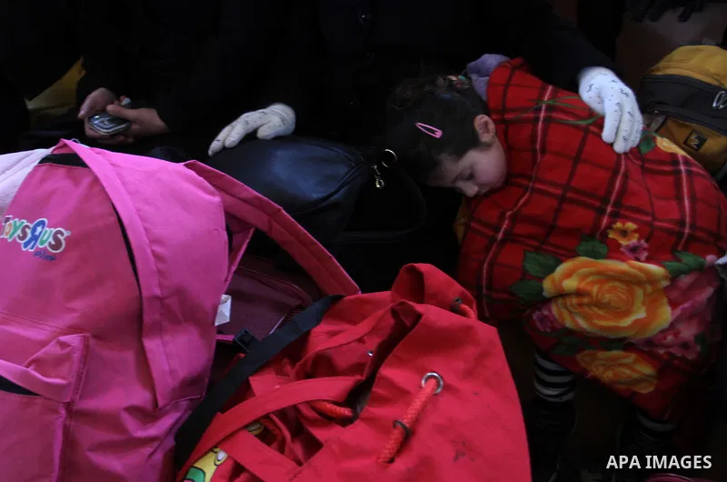 Palestinians await permission to enter Egypt as they gather at the Rafah border crossing in the southern Gaza Strip on February 13, 2016. The Gaza Strip's border crossing with Egypt at Rafah is set to reopen for two days...