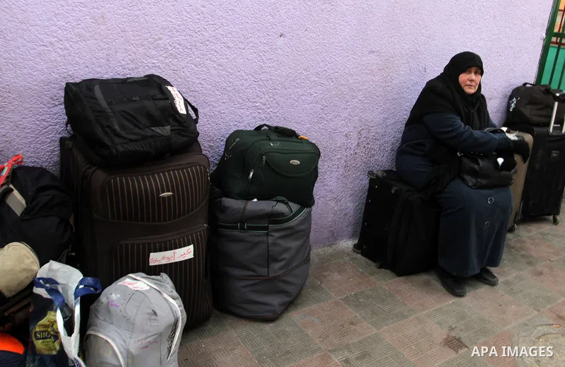 Palestinians await permission to enter Egypt as they gather at the Rafah border crossing in the southern Gaza Strip on February 13, 2016. The Gaza Strip's border crossing with Egypt at Rafah is set to reopen for two days...