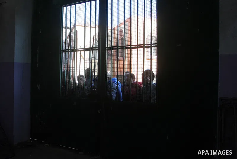 Palestinians await permission to enter Egypt as they gather at the Rafah border crossing in the southern Gaza Strip on February 13, 2016. The Gaza Strip's border crossing with Egypt at Rafah is set to reopen for two days...