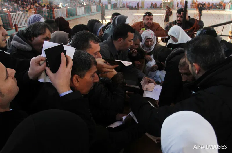 Palestinians await permission to enter Egypt as they gather at the Rafah border crossing in the southern Gaza Strip on February 13, 2016. The Gaza Strip's border crossing with Egypt at Rafah is set to reopen for two days...