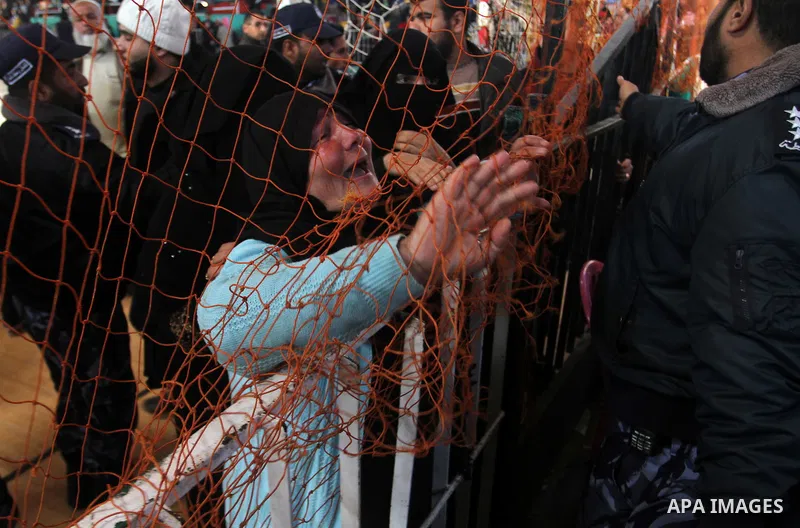 Palestinians await permission to enter Egypt as they gather at the Rafah border crossing in the southern Gaza Strip on February 13, 2016. The Gaza Strip's border crossing with Egypt at Rafah is set to reopen for two days...