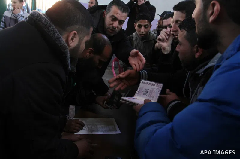Palestinians await permission to enter Egypt as they gather at the Rafah border crossing in the southern Gaza Strip on February 13, 2016. The Gaza Strip's border crossing with Egypt at Rafah is set to reopen for two days...