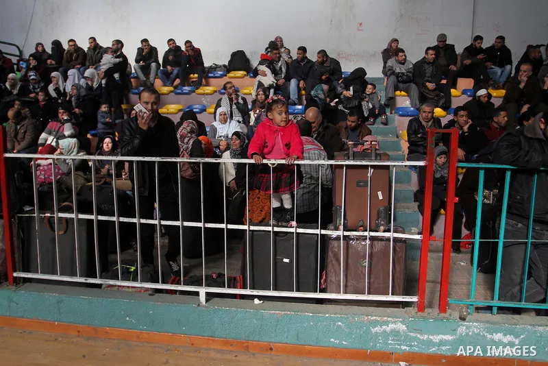 Palestinians await permission to enter Egypt as they gather at the Rafah border crossing in the southern Gaza Strip on February 13, 2016. The Gaza Strip's border crossing with Egypt at Rafah is set to reopen for two days...