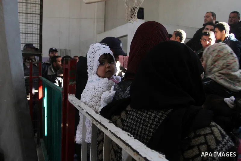 Palestinians await permission to enter Egypt as they gather at the Rafah border crossing in the southern Gaza Strip on February 13, 2016. The Gaza Strip's border crossing with Egypt at Rafah is set to reopen for two days...