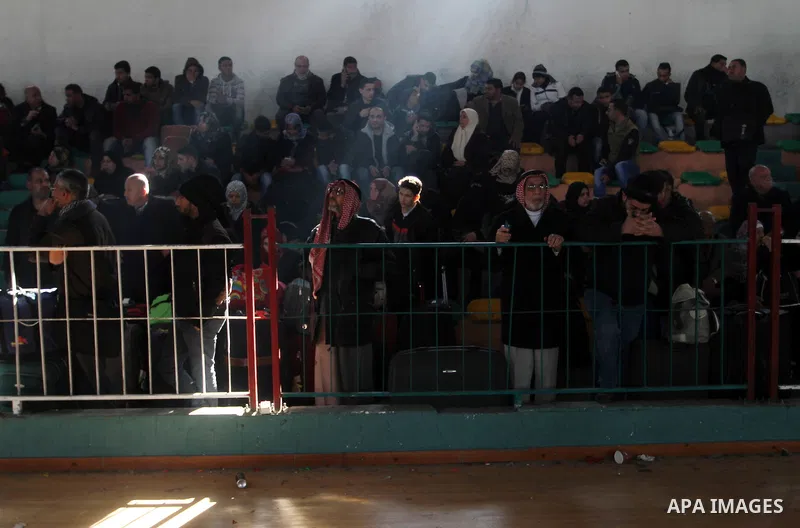 Palestinians await permission to enter Egypt as they gather at the Rafah border crossing in the southern Gaza Strip on February 13, 2016. The Gaza Strip's border crossing with Egypt at Rafah is set to reopen for two days...