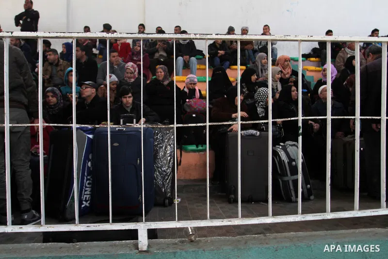 Palestinians await permission to enter Egypt as they gather at the Rafah border crossing in the southern Gaza Strip on February 13, 2016. The Gaza Strip's border crossing with Egypt at Rafah is set to reopen for two days...