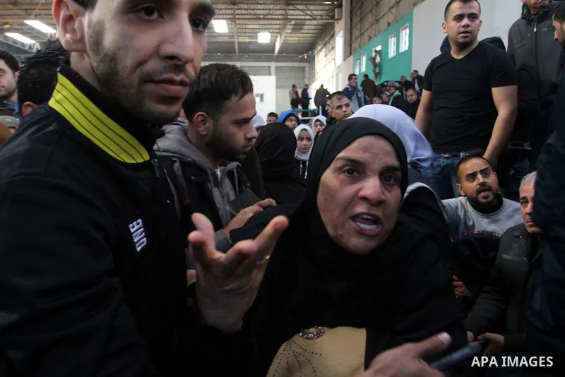 Palestinians await permission to enter Egypt as they gather at the Rafah border crossing in the southern Gaza Strip on February 13, 2016. The Gaza Strip's border crossing with Egypt at Rafah is set to reopen for two days...