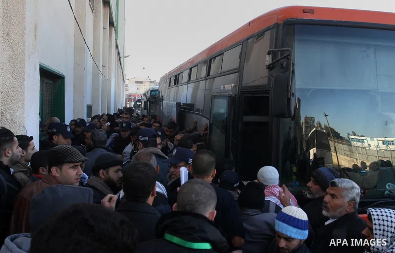 Palestinians await permission to enter Egypt as they gather at the Rafah border crossing in the southern Gaza Strip on February 13, 2016. The Gaza Strip's border crossing with Egypt at Rafah is set to reopen for two days...