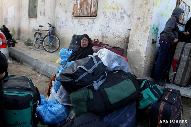 Palestinians await permission to enter Egypt as they gather at the Rafah border crossing in the southern Gaza Strip on February 13, 2016. The Gaza Strip's border crossing with Egypt at Rafah is set to reopen for two days...