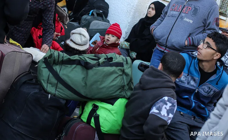 Palestinians await permission to enter Egypt as they gather at the Rafah border crossing in the southern Gaza Strip on February 13, 2016. The Gaza Strip's border crossing with Egypt at Rafah is set to reopen for two days...