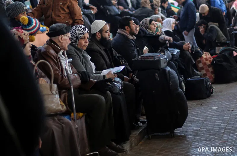 Palestinians await permission to enter Egypt as they gather at the Rafah border crossing in the southern Gaza Strip on February 13, 2016. The Gaza Strip's border crossing with Egypt at Rafah is set to reopen for two days...