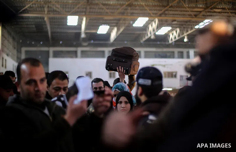 Palestinians await permission to enter Egypt as they gather at the Rafah border crossing in the southern Gaza Strip on February 13, 2016. The Gaza Strip's border crossing with Egypt at Rafah is set to reopen for two days...