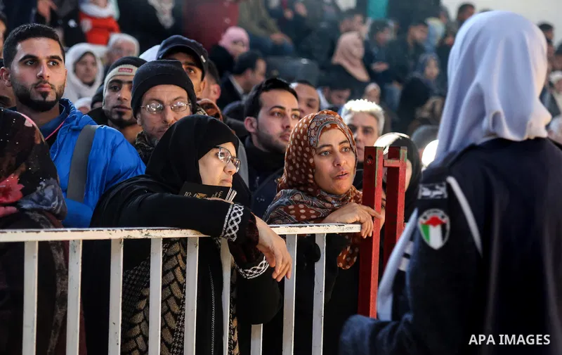 Palestinians await permission to enter Egypt as they gather at the Rafah border crossing in the southern Gaza Strip on February 13, 2016. The Gaza Strip's border crossing with Egypt at Rafah is set to reopen for two days...