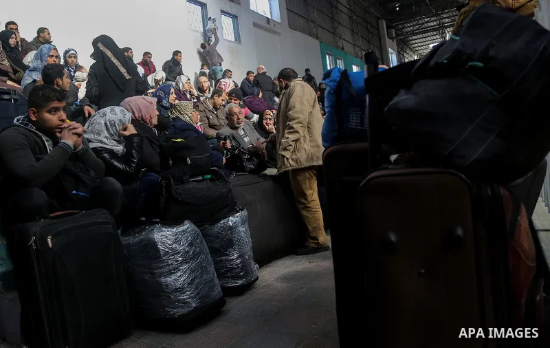 Palestinians await permission to enter Egypt as they gather at the Rafah border crossing in the southern Gaza Strip on February 13, 2016. The Gaza Strip's border crossing with Egypt at Rafah is set to reopen for two days...