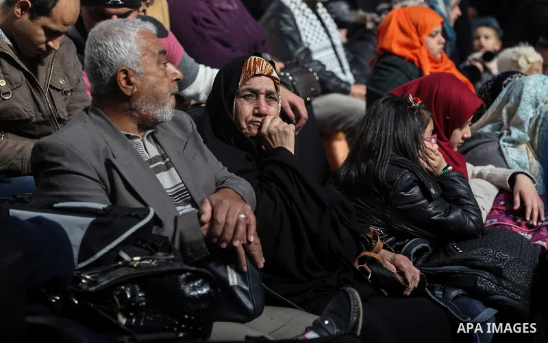 Palestinians await permission to enter Egypt as they gather at the Rafah border crossing in the southern Gaza Strip on February 13, 2016. The Gaza Strip's border crossing with Egypt at Rafah is set to reopen for two days...