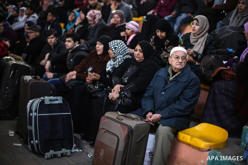 Palestinians await permission to enter Egypt as they gather at the Rafah border crossing in the southern Gaza Strip on February 13, 2016. The Gaza Strip's border crossing with Egypt at Rafah is set to reopen for two days...