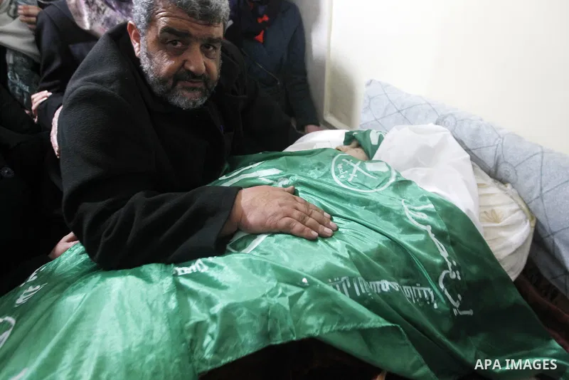 Palestinian relatives react next to the body of 17-year-old woman Kilzar Owaiwi, who was shot dead by Israeli troops after the troops said she attempted to stab an Israeli soldier, in the West Bank city of Hebron Februar...