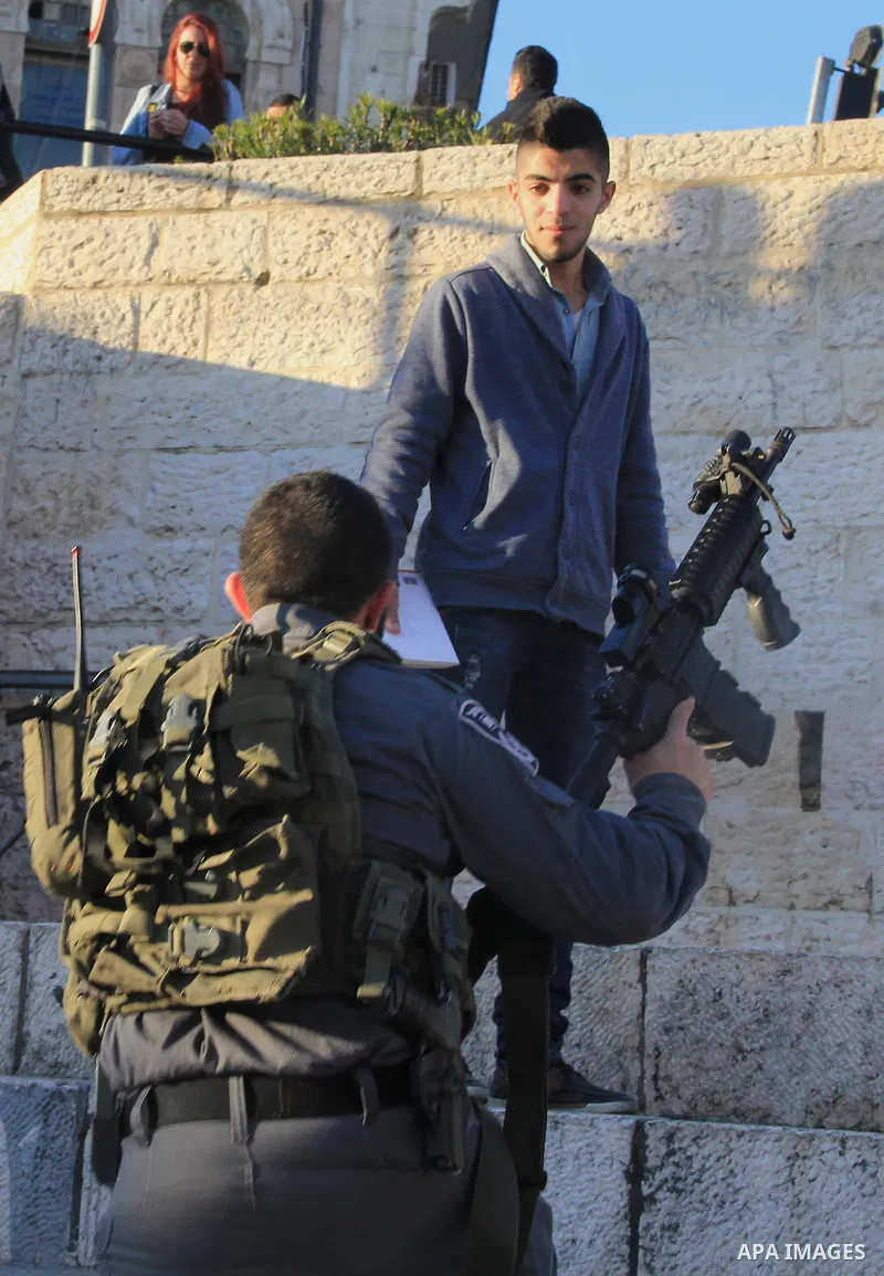 Israeli policemen detain a Palestinian man at Damascus Gate, a main entrance to Jerusalem's Old City on February 13, 2016. Photo by Mahfouz Abu Turk