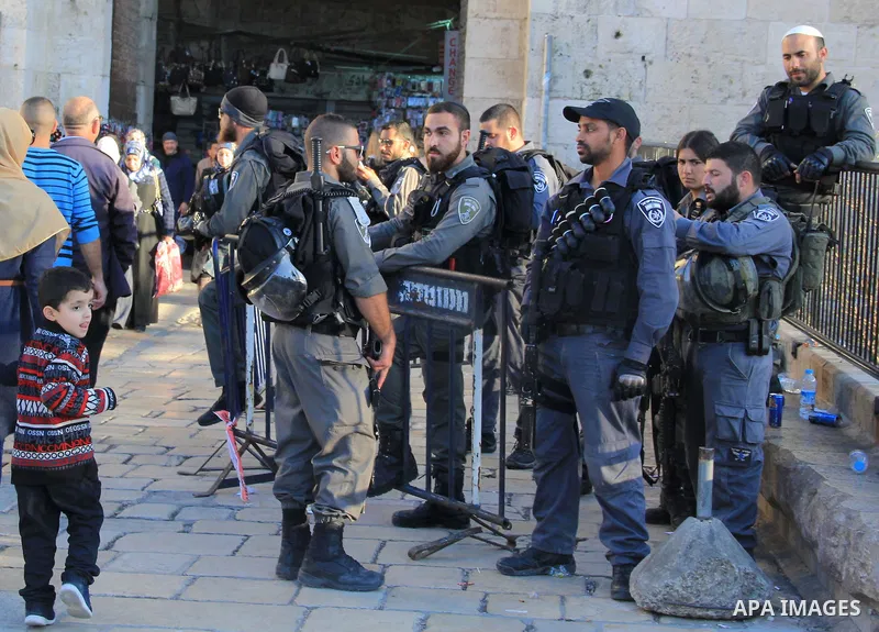 Israeli border policemen stand guard at Damascus Gate, a main entrance to Jerusalem's Old City on February 13, 2016. Photo by Mahfouz Abu Turk