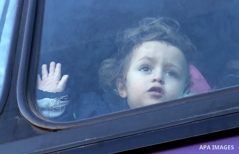 Palestinians wait for a travel permit to cross into Egypt through the Rafah border crossing between Egypt and the southern Gaza Strip February 14, 2016. Egypt opened the Rafah border crossing on Saturday for two days to...