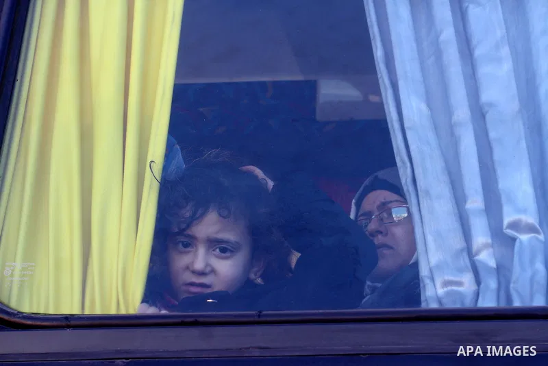 Palestinians wait for a travel permit to cross into Egypt through the Rafah border crossing between Egypt and the southern Gaza Strip February 14, 2016. Egypt opened the Rafah border crossing on Saturday for two days to...