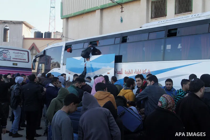 Palestinians wait for a travel permit to cross into Egypt through the Rafah border crossing between Egypt and the southern Gaza Strip February 14, 2016. Egypt opened the Rafah border crossing on Saturday for two days to...