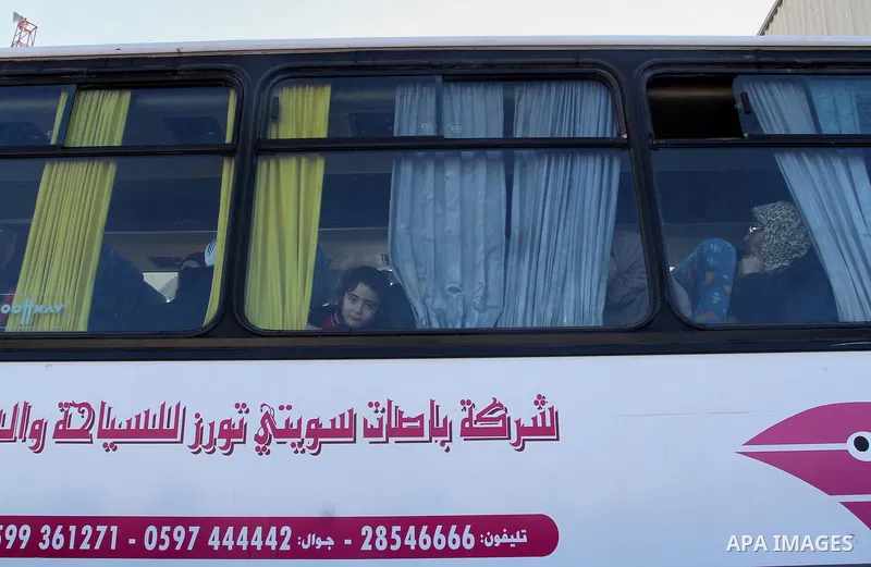 Palestinians wait for a travel permit to cross into Egypt through the Rafah border crossing between Egypt and the southern Gaza Strip February 14, 2016. Egypt opened the Rafah border crossing on Saturday for two days to...