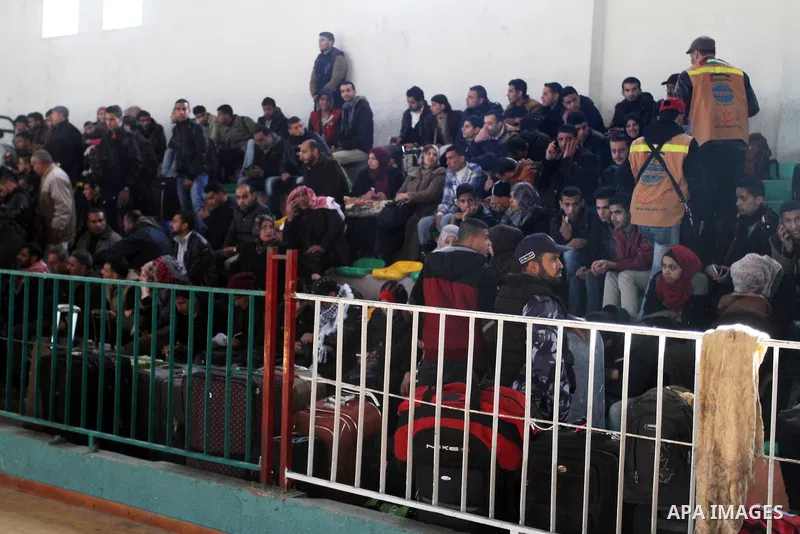 Palestinians wait for a travel permit to cross into Egypt through the Rafah border crossing between Egypt and the southern Gaza Strip February 14, 2016. Egypt opened the Rafah border crossing on Saturday for two days to...